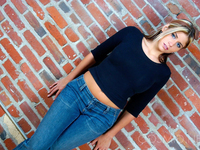 Hot amateur Tara doffs her tight sweater to tease with big tits in satin bra